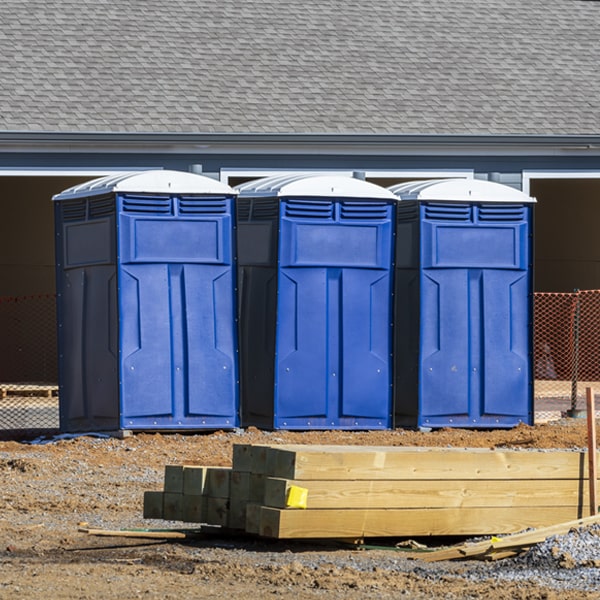 what is the cost difference between standard and deluxe portable toilet rentals in Adams